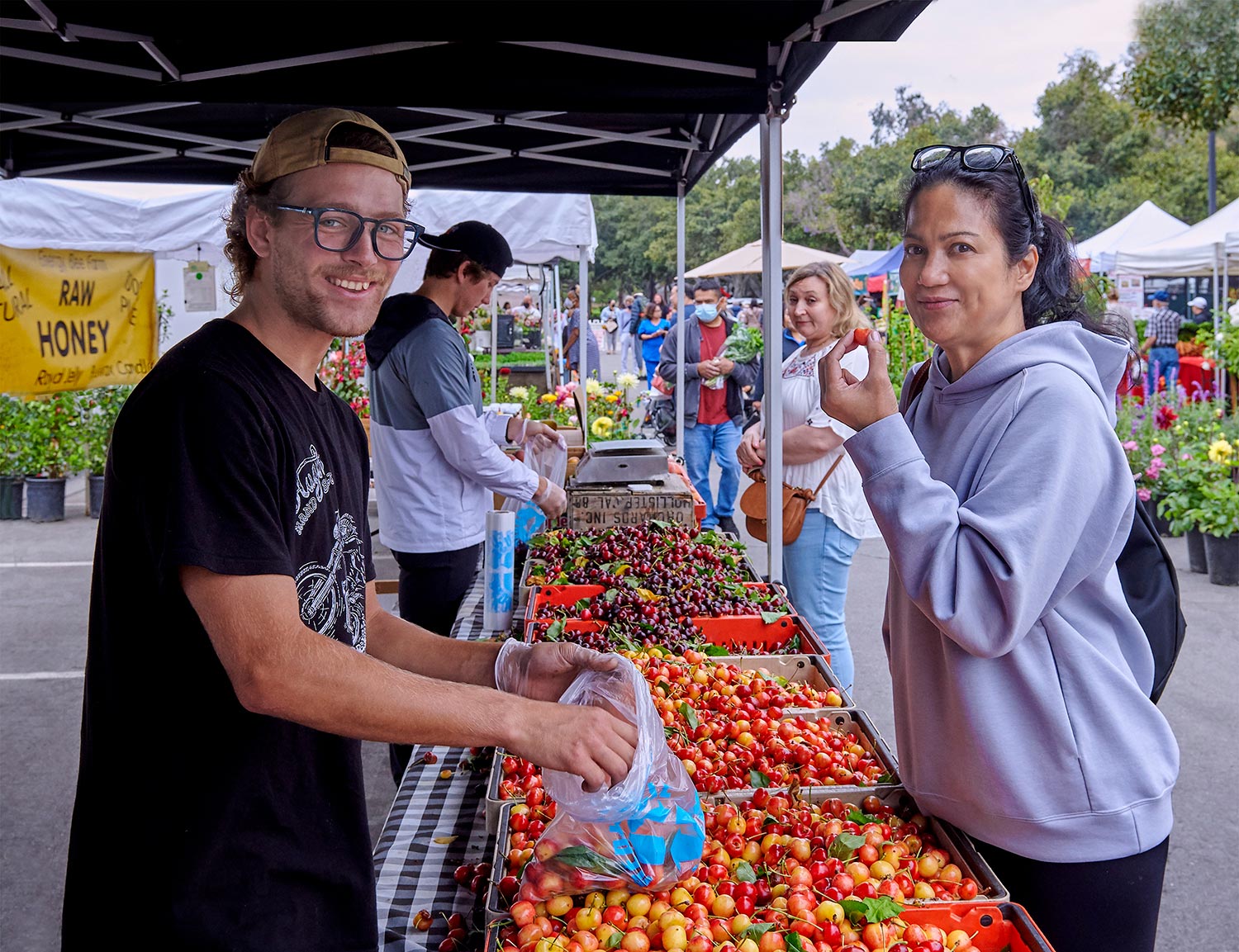 Farmers Market with tomatoes, vendor and customer